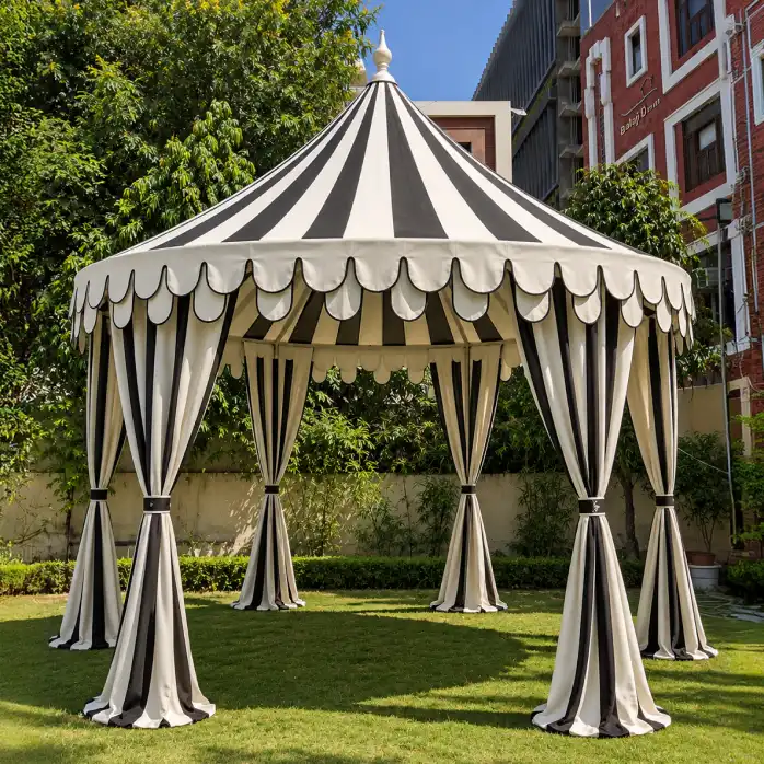 A timeless silhouette for memorable spaces.
The round canopy is a classic expression of our tent-making heritage. Its balanced form creates an inviting setting for weddings, dining, ceremonies, lounges, and hospitality spaces.
Combining traditional craftsmanship with durable, weather-resistant materials, our round canopies can be transformed through custom fabrics, hand-block prints, colours, patterns, and bespoke detailing to reflect the character of each event.